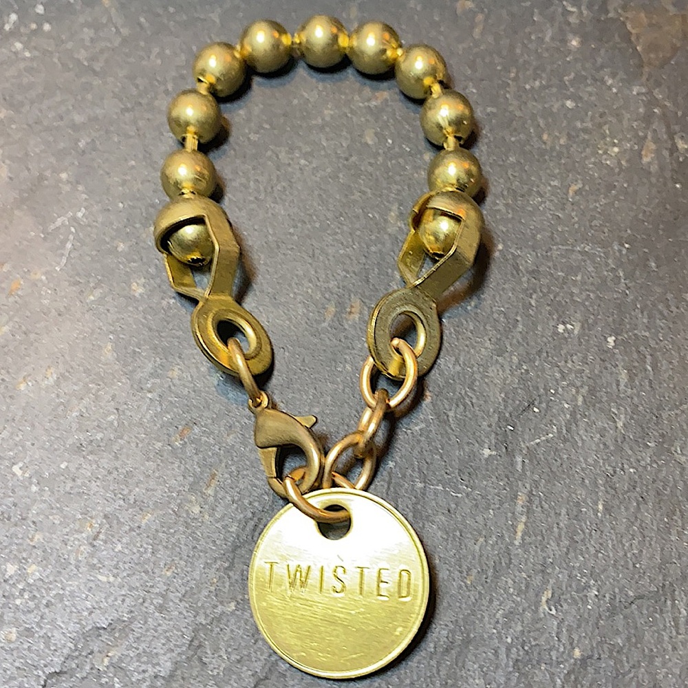 Twisted Silver Bracelet. Coin with engraved brand